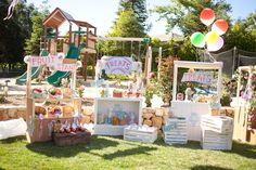 there are many items on display in the yard for children's birthdays and baby showers