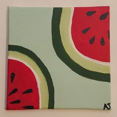 a piece of art with watermelon slices painted on it