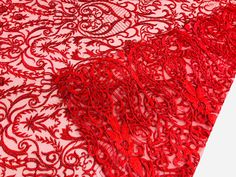 red lace fabric on white background