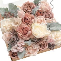 a box filled with lots of pink and white flowers