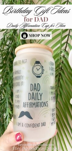 a person holding up a coffee mug with the words dad daily affirmations on it