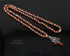 "Silver handmade caps with natural rudraksha beads necklace and pendant, rudraksha mala . fabulous unisex silver jewelry. maks excellent gifting . Weight-24.200 grams length-26\" inches. Beads size-6 mm. Pendant height-4 centimeters. Pendant width-2 centimeters. metal-925 silver brand-handmade. Stamped-925 on pendant material-natural rudraksha beads." Silver Mala For Festivals, Spiritual Silver Mala With 8mm Beads, Spiritual Silver Beads Round Pendant Jewelry, Handmade Silver Mala Spiritual Style, Silver Mala With Round Beads For Gift, Silver Spiritual Jewelry With 8mm Beads, Silver Mala With Polished Beads For Festivals, Polished Beads Jewelry For Meditation And Festivals, Handmade Silver Spiritual Mala