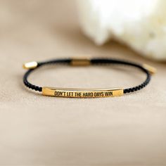 DESCRIPTIONThis motivational tube bracelet bears the engraved mantra, "Don't let the hard days win." This bracelet goes beyond mere adornment; it's a heartfelt gesture meant to provide a daily dose of motivation and resilience. As you wear it, you'll find the courage to face adversity head-on and refuse to succumb to the challenges life throws your way. Whether presented on special occasions or as a spontaneous gesture of support, this bracelet carries a profound message. It embodies an unwaveri Pray Through It, Pray On It, Motivational Bracelets, Tube Bracelet, Empowering Words, Remember Who You Are, Hard Days, Halloween Sale, A Daily Reminder