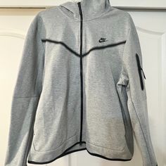 New With Tags! Nike - Men's Xxl Sweatshirt With Hood And Zipper - Grey And Black Cheap Gray Hooded Jacket For Streetwear, Grey Nike Hoodie Mens, Nike Zip Up Hoodie Men, Nike Tech Sweater, Gray Nike Fleece Hoodie, Nike Gray Hooded Jacket, Grey Nike Zip Up Hoodie, Nike Gray Long Sleeve Hooded Jacket, Nike Tech Fleece Jacket