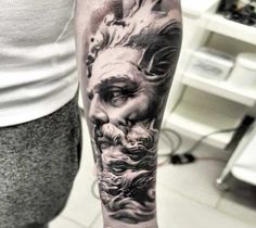 a man with a tattoo on his arm