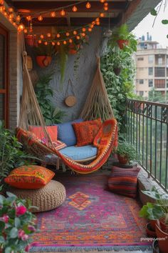 an outdoor patio with hammock chairs and potted plants on the balcony area