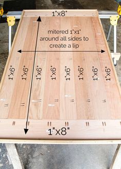 a wooden table with measurements on it