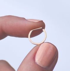 This 14k gold filled square septum ring is the perfect simple ring for everyday wear. It is lightweight and the straight pin makes for a very comfortable fit. Much thinner than our regular square septum ring, and easier to maneuver. This is for those that prefer a more minimal look and feel. Available in your choice of 18 gauge or 16 gauge pin. When measuring your nose ring for comparison, use the inside diameter of the ring you already have. When putting this ring in, we recommend bending the p Big Statement Rings, Gold Nose Ring, Septum Rings, Septum Piercings, Gold Nose Rings, Simple Ring, Septum Piercing, Nose Rings, Nose Ring Stud