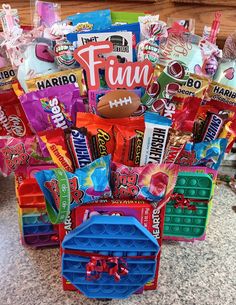 a basket filled with candy and candies on top of a counter