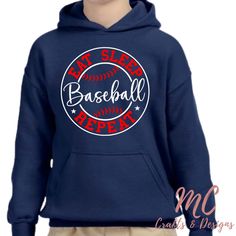 Gear up your young baseball enthusiast in style with our Youth Baseball Hoodie. Crafted for comfort and durability, this hoodie features a sporty design with a baseball graphic, making it the perfect choice for casual wear or to showcase team spirit.  The soft, breathable fabric ensures all-day comfort, while the kangaroo pocket adds a practical touch. Ideal for chilly game days or everyday play, this hoodie is a home run for young baseball fans.   Can be personalized with player name on the back. TO ORDER: 1. Select your the color you want the hoodie. 2. Select hoodie size - Youth and adult sizes available. 3. If you would like it personalized, please enter name in the personalization field. If you have any questions, please don't hesitate sending us a message. College Team Hoodie For Baseball Season, College Team Name Hoodie For Baseball Season, College Hoodie With Team Name For Baseball Season, College Hoodie For Baseball Season With Team Name, Sporty Hoodie With Graphic Print For Baseball Season, Hooded Baseball Season Sports Sweatshirt, Baseball Season Sports Hoodie, Baseball Season Graphic Print Hoodie, Sporty Pre-shrunk Hoodie For Baseball Season