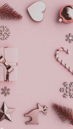 a pink background with christmas decorations and gifts