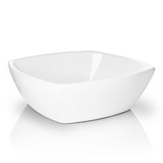 a large white bowl sitting on top of a table