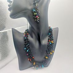 Beautiful set of black beads with Lucite multicolor beads in between very unique and stunning.  Necklace is 6 strands and 16" hook earrings are 2.5" dangle. In excellent condition.  Please see my other listings for more great vintage finds Black Bohemian Earrings With Faceted Beads, Black Multi-strand Costume Jewelry, Black Beaded Dangle Earrings With Beaded Chain, Black Beaded Chain Dangle Earrings, Black Bohemian Beaded Earrings With Beaded Chain, Black Bohemian Beaded Chain Earrings, Black Dangle Beaded Necklace For Party, Black Bohemian Multi-strand Beads, Bohemian Black Multi-strand Beads