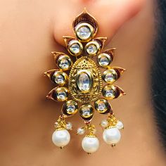 These are a beautiful pair of Earrings, made with beautifully Kundan beaded. These earrings work well with all types of clothing, whether it be formal attire or a casual party. Option 1: Red Color (E728) Option 2: White Color (E729) Eye-catching and unique jewellery that will set you apart. Gift this piece to a loved one, and see their face light up with joy. Best for gifting or for personal use, wear it to any occasion and be in the spotlight.