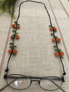 This is a unique, elegant-looking, and 100 % handmade needle lace eyeglasses chain. Beautifully crochet by using a needle and silk thread that can be used as an eyeglass chain, reading glasses chain, or sunglasses chain. Handmade Glasses Chain - Face Mask Chain - Eyeglass Strap - Handcrafted Sunglasses Holder - Glasses Chain Holder - Crochet Glass Chain Free Shipping! It is a multifunctional gift that with the attached claps, this can be used as a face mask chain or face mask holder. The leaves Crochet Glasses Chain, Granny Glasses, Strap Crochet, Beads Projects, Vendor Ideas, Flower Glasses, Chains Aesthetic, Eyeglasses Chain