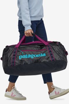 Perfect for gearheads, the Black Hole® Duffel 70L easily swallows a week’s worth of stuff and is made with 100% recycled body fabric, lining and webbing. Recycled87% of our line uses recycled materials. Features Made from lightweight yet extremely durable, 100% recycled polyester ripstop with a TPU-film laminate to create a fabric that’s weather-resistant, abrasion-resistant and highly packable; lined with 100% recycled polyester with a tough polyurethane coating Top zipper allows bag to open wi Patagonia Shop, Patagonia Black Hole, Patagonia Brand, Black Travel, Swallows, Ripstop Fabric, Black Hole, Fjallraven Kanken, Outdoor Outfit