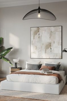 a bedroom with a large painting hanging above the bed