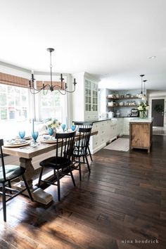 a dining room table and chairs in a kitchen