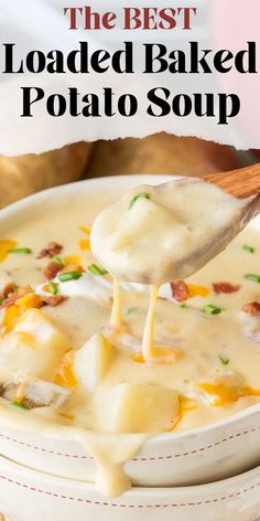 the best loaded baked potato soup in a white bowl with a wooden spoon full of cheese