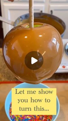 an apple with a stick sticking out of it's center and the words let me show you how to turn this