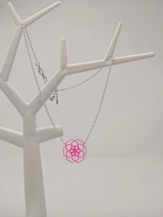 With a touch of silver and a splash of vibrant color, this necklace with 3D printed geometric flower pendant adds just the right wink of uniqueness to any look! (And just wait until you see it glow under blacklight!) This pendant necklace is printed with TPU filament, a flexible, translucent plastic, and printed on an Anet AM8 3D printer. The fine lines--each one less than a quarter of a millimeter thick--that make up each layer adds a dimension that makes them almost shimmer in light. And this Hypoallergenic Pink Sterling Silver Necklace, Geometric Pink Jewelry For Gifts, Geometric Pink Jewelry For Gift, Pink Geometric Jewelry For Gifts, Pink Geometric Jewelry For Gift, Pink Sterling Silver Necklace With Large Pendant, Geometric Silver Necklace For Gift, Pink Sterling Silver Flower Pendant Necklace, Silver Geometric Necklace For Gift