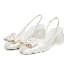 Elegant white satin slingback pumps featuring a round toe, pearl bow embellishment, and heels. Perfect for adding a touch of sophistication and charm to any outfit or occasion. Color: White Material: Satin Heel Type: Chunky heel Heel Height: 2.17'' / 55 mm approx Product measurements were taken using size 8. Please note that measurements may vary by size. Toe: Round toe Pearl bow embellishment design Elastic slingback design Handcrafted US sizing. Fits true to size. White Heels With Bow Straps For Formal Occasions, Formal White Heels With Bow Straps, Elegant White Slingback Pumps With Round Toe, White Evening Heels With Bow Straps, White Mini Heels, Chic Bow Slingback Pumps For Wedding, White Pointed Toe Heels With Bow Straps, Summer Wedding Slingback Pumps With Bow, Chic White Slingback Pumps With Bow