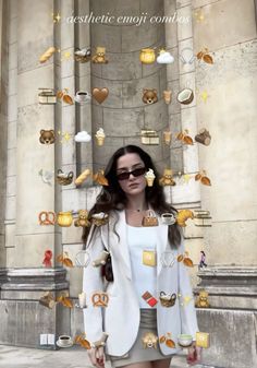 a woman standing in front of a building with lots of objects floating out of it