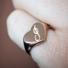 The heart signet ring is a classic, and this one is personalized with an inset monogram. This item is engravable with text or monogram of your choice at no extra cost. The initals are engraved onto the ring and embedded in the 3D model for a flawless embossed finish. You may choose to customize this ring with different images, letters or words. A render of your custom design will be sent to you before production. Heart width: 12mm Heart height: 10mm A few notes about our gold: - Though we do not Personalized Heirloom Rose Gold Initial Ring, Classic Personalized Rose Gold Initial Ring, Symbolic Personalized Yellow Gold Signet Ring, Symbolic Yellow Gold Signet Ring Engraved, Personalized Yellow Gold Signet Ring, Classic Heart-shaped Signet Ring For Wedding, Personalized Rose Gold Sterling Silver Signet Ring, Personalized Heirloom Rose Gold Signet Ring, Classic Heart-shaped Sterling Silver Engraved Ring