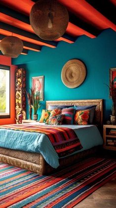 a bedroom with blue walls and colorful rugs