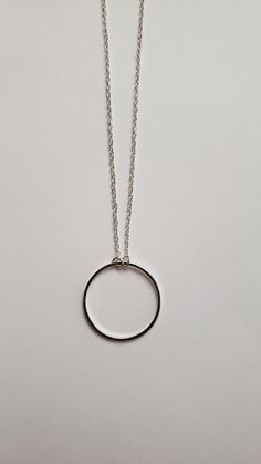 "Sometimes you need just a little something to give that extra spark to your outfit. This is it. This simple yet elegant necklace will soon be a favorite. It features your choice of a repurposed silver circle charm that is just shy of 1\" in diameter or a repurposed bronze silver circle charm that is 3/4\" in diameter. Both dangle from a 16\" chain with a 2\" extender. It's a minimalist's dream as it will wear well with all outfits. Your choice of color - silver-tone or antique bronze. Welcome to Recycled Finery!  I repurpose old jewelry, coins, beads, vintage buttons, watch parts, and charms into new jewelry.  My ever-growing collection of these materials comes from estate sales, rummage sales, antique and thrift stores, and family and friends' collections they no longer need or want. I h Simple Round Everyday Necklace, Simple Everyday Round Necklace, Sterling Silver Jewelry With Simple Design, Dainty Silver Circular Jewelry, Simple Open Circle Jewelry For Gift, Minimalist Delicate Chain Charm Necklace For Bridesmaids, Minimalist Charm Necklace With Silver Chain, Minimalist Silver Chain Charm Necklace, Minimalist Open Circle Jewelry For Gifts