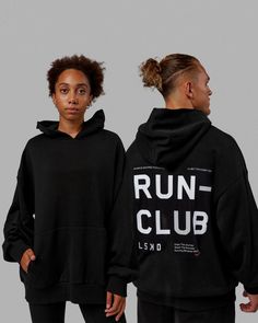 Unisex Love The Run Hoodie Oversize - Black-White | LSKD Black Hoodie With Logo Print In Athleisure Style, Athleisure Hoodie With Letter Print For Sports, Athleisure Sports Hoodie With Letter Print, Techwear Activewear For Streetwear With Hood, Athleisure Hoodie For Running, Urban Style Sweat Resistant Activewear For Streetwear, Fitness Merch, Athleisure Hoodie For Running During Sports Season, Athleisure Running Hoodie For Sports Season