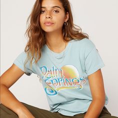 Daydreamer Blue Palm Springs Short Sleeve Cotton T-Shirt Size Small 100% Cotton Brand New With Tags Trendy Light Blue Spring T-shirt, Light Blue Graphic Tee For Summer, Blue Graphic Print Top For Day Out, Light Blue Graphic Print Top For Spring, Relaxed Graphic Print Tops For Spring, Light Blue Graphic Tee With Relaxed Fit, Blue Relaxed Fit T-shirt, Relaxed Blue Crew Neck Top, Blue Summer T-shirt For Day Out