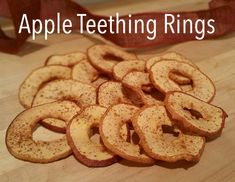 apple teeth rings on a cutting board with the words apple teeth rings in front of them