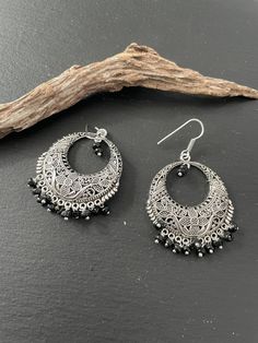 Indus Earrings : Back to our Roots. For the women who makes a statement.  An exclusive shop for earrings. Wear them with pride.  These are dangling drops style earrings . An unique handmade Indian style ethnic bohemian/ Tribal earrings in silver shade.  These earrings are made from high quality Tatanium / German silver material  which are hypoallergenic and free from corrosion & rusting.  Notes : The product shipped will be same as shown in the picture, however the actual colours may vary slight Traditional Dangle Chandelier Earrings, Bohemian Oxidized Chandelier Earrings For Festive Occasions, Bohemian Oxidized Finish Chandelier Earrings For Festive Occasions, Bohemian Silver Chandbalis With Matching Earrings, Black Bohemian Teardrop Earrings As Gift, Bohemian Black Teardrop Earrings As Gift, Black Bohemian Teardrop Earrings For Gift, Teardrop Chandelier Earrings For Festival, Handmade Metal Drop Chandbalis