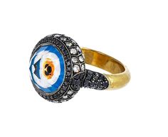 Brilliantly imagined and executed to the most perfect, exquisite detail, this one-of-a-kind Sevan Bicakci ring embodies the traditional symbol of protection against negativity. Perfectly, masterfully hand-crafted, the three dimensional evil eye has been created by intaglio carving - a technique using reverse carving from the underside of the stone - into the underside of the faceted rock quartz. Painstakingly painted to precision, the vibrant eye is encased in the stone which is framed by an int Sevan Bicakci, Symbol Of Protection, Carved Ring, Vibrant Eyes, Evil Eye Ring, Micro Mosaic, Diamond Quartz, Fancy Diamonds, Eye Ring