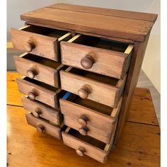 a wooden drawer with six drawers on it