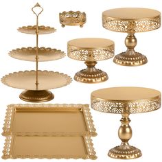 there are many different types of trays on the table and one has a cake stand