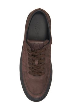 Crafted from coffee-colored nubuck leather, this versatile sneaker serves signature style with a cutout bell logo carving the counter. Lace-up style Leather upper and lining/rubber sole Imported Designer Shoes Brown Leather Sneakers With Embossed Logo, Brown Low-top Sneakers With Embossed Logo, Brown High-top Calf Leather Sneakers, Brown Calf Leather Sneakers With Rubber Sole, Brown Calf Leather Sneakers With Stitched Sole, Brown Suede Sneakers With Stitched Sole, Luxury Brown Leather High-top Sneakers, Designer Brown Sneakers With Rubber Sole, Designer Brown Calf Leather Sneakers