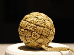 a ball of rope sitting on top of a table