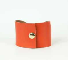 "Orange Crush Bow Tie Vegan Leather Wide Cuff Bracelet by ForgottenCotton Because we know that Bow Ties are cool. Our orange crush bow tie cuff is perfect 'oh so adorable' accessory. Dressed up or down, it is versatile, cute, and sure to get tons of compliments. Why we love it: Our cuffs are made to be versatile. You can wear our cuffs on either your wrist or your scarf (or both!) We chose high quality vegan leather that has the look and feel of leather without the guilt. Hand stitched to perfec Adjustable Cuff Wristband, Adjustable Cuff Bracelet With Wrist Strap, Adjustable Cuff Leather Bracelet, Wide Tattoo, Scarf Cuff, Orange Bracelet, Wide Cuff Bracelets, Bow Bracelet, Tattoo Cover