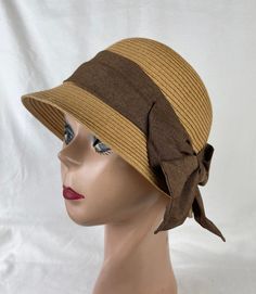 This soft Toyo Straw vintage-inspired cloche hat is lightweight and the hat will fit up to 22 5/8 inch head size which an inside sizing cord to adjust to your head size. The brim is 2 inches wide. The brim is about 4 1/2 inches tall. The bow band is made from cotton and linen blend material. NOTE: Please check the head size before purchase, I am happy to answer any questions you may have. There will be a 20% restocking fee for all returned hats. Classic Cloche Hat For The Beach, Spring Adjustable Cloche Hat For Church, Adjustable Cloche Hat For Church In Spring, Beige Cloche Hat For Vacation, Adjustable Cloche Hat For Vacation, Brown Brimmed Cloche Hat One Size, Summer Cloche Sun Hat, One Size Fits Most, Brown Brimmed Cloche Hat, One Size Fits Most, Brown Brimmed Cloche Hat