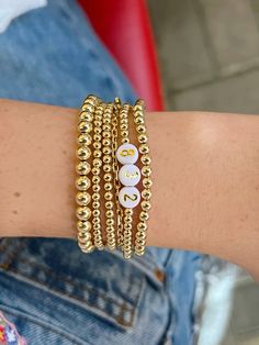 #goldbracelet #goldjewelry #enewton #gradgift #custom #customjewelry #custombracelet Gold Bead Bracelet, Gold Beaded Bracelet, Trendy Bracelets, Graduation Diy, Gold Bead Bracelets, Personalized Graduation Gifts, Grad Gifts, Stretchy Bracelets, Custom Bracelets