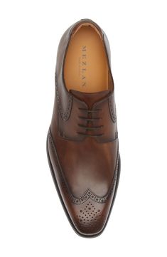 Classic broguing stipples the upper of a burnished-leather derby that adds clean grounding to your sophisticated styles. Lace-up style Cushioned footbed Leather upper and lining/rubber sole Made in Spain Leather Oxfords With Perforated Toe Box For Semi-formal Occasions, Fitted Calf Leather Oxfords With Brogue Detailing, Classic Formal Derby Shoes With Perforated Toe Box, Formal Wingtip Derby With Perforated Toe Box, Formal Brogue Calf Leather Oxfords, Formal Calf Leather Brogue Oxfords, Classic Leather Shoes With Perforated Almond Toe, Elegant Brown Derby Shoes With Brogue Detailing, Elegant Brown Derby With Brogue Detailing