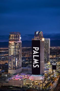 an aerial view of the las vegas strip at night with lights and buildings in the background