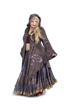 "A graceful, flowing velvet jacket fit for a faery goddess. Angel sleeves, pixie points on the hem and a large hood. Beautifully embroidered with plant patterns. Lined with light floaty Indian cotton.   SIZES  SMALL: Bust: 33.5\" (85 cm) Waist: 30\" (76 cm) Arm: 23\" (58 cm) Length: 47\" (119 cm) MEDIUM: Bust: 35.5\" (90 cm) Waist: 32\" (81 cm) Arm: 24\" (61 cm) Length: 48\" (122 cm) LARGE: Bust: 37.5\" (95 cm) Waist: 34\" (86 cm) Arm: 25\" (64 cm) Length: 49\" (124 cm) XL: Bust: 39.5\" (100 cm) Fae Clothing, Boho Sweater Coat, Lilac Velvet, Pagan Clothing, Fall Fashion Skirts, Fairy Festival, Angel Sleeves, Bohemian Clothing, Witch Outfit