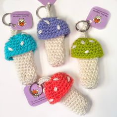 crocheted ice cream keychains with tags attached to them on a white surface