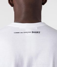 Revamp your basics with the Comme des Garçons Script Neck Logo T-Shirt in crisp white. Crafted from premium cotton, this tee embodies urban elegance. Featuring a minimalist CDG script logo on the neckline, it adds a touch of sophistication to your ensemble. Its versatile white hue allows for effortless pairing with any outfit. Whether you're running errands or meeting friends, this tee ensures both comfort and style all day long. Relaxed fit, take your usual size for a looser fit 100% Cotton Ribbed crewneck Mid-length sleeves Comme des Garçons script logo on rear Model wears: MediumModel height: 6ft/182.88cm 999 Design, Minimalist Tshirt Design, Tshirt Branding, Minimalist Tshirt, Meeting Friends, Comme Des Garcons Shirt, Mid Length Sleeves, Designer Menswear, Script Logo