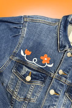 Expertly hand-painted and beautifully crafted, the UT Floral Letters Denim Jacket combines elegant floral design with bold lettering for a unique and stylish look. Made with high-quality denim, this jacket is both durable and fashionable, making it a must-have for any wardrobe. Perfect for any occasion, this jacket is sure to make a statement. Details:- Hand-painted at JFY- One of a Kind- Balloon Sleeve Denim Jacket- Perfect Game Day Gear Fabric Content:- 96.6% Cotton, 0.4% Spandex Washing Instr Customized Jeans Jacket, Trendy Denim Jacket With Floral Print, Trendy Floral Print Denim Jacket, Floral Print Denim Jacket For Summer, Spring Cotton Denim Jacket With Graphic Print, Spring Graphic Print Denim Jacket, Casual Cotton Denim Jacket With Floral Print, Casual Summer Denim Jacket With Floral Print, Casual Floral Print Denim Jacket For Summer