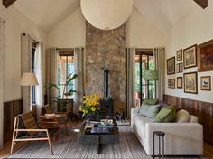 a living room filled with furniture and a fire place