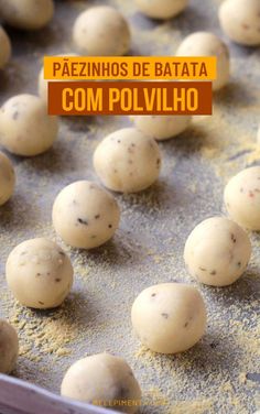 some balls of food are on a baking sheet with the words paezinos de batata com polivlio